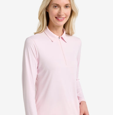 Woman wearing a light pink long-sleeve shirt on a white background