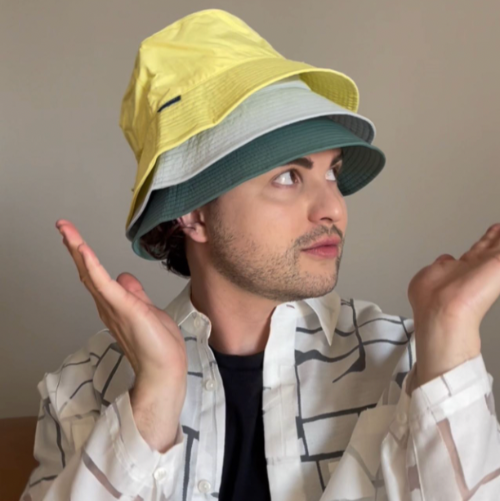 A man wearing 3 Solbari hats